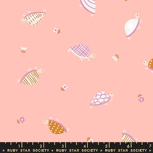 May include: A repeating pattern of cartoon turtles and small flowers on a light pink background. The turtles have patterned shells in white, gold, and pink. The text "RUBY STAR SOCIETY" is at the bottom.