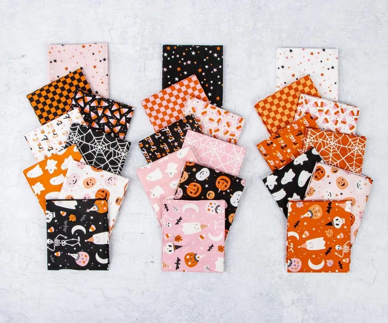 May include: A collection of Halloween-themed fabric squares in various patterns and colors. Designs include stars, checkerboard, spiderwebs, ghosts, pumpkins, and skeletons. The color palette features orange, black, pink, and white, perfect for crafting projects.