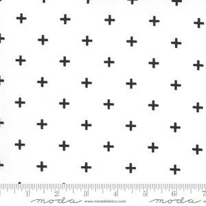 May include: White fabric with a repeating pattern of black plus signs.