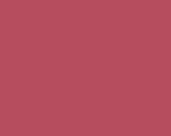 May include: Solid color background in a deep red shade.