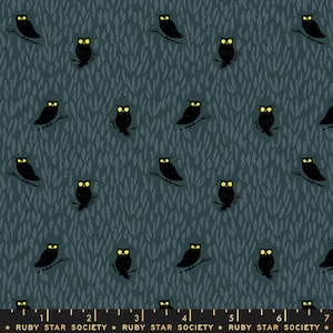 May include: A teal blue fabric with a repeating pattern of black owls with yellow eyes. The owls are perched on branches and are surrounded by a pattern of small, white, brushstroke-like marks.