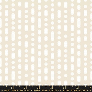 May include: Cream-colored fabric with a repeating pattern of white, elongated ovals and circles. The design is vertically oriented, creating a textured appearance. The bottom of the image includes a ruler and the text "RUBY STAR SOCIETY".