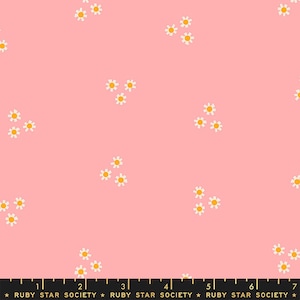 May include: Pink fabric with a white daisy pattern. The daisies have yellow centers.