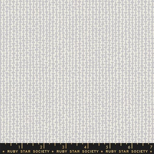May include: A white fabric with a repeating pattern of small, light gray, vertical lines. The lines are made up of a series of small, irregular shapes.