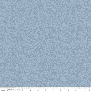 May include: A blue fabric with a white floral pattern. The pattern is a repeating design of small flowers and leaves.