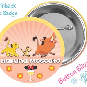 May include: A 3-inch pinback park badge featuring a pink background with a yellow sunburst design. The badge features the characters Simba, Timon, and Pumbaa from Disney's The Lion King. The text "Hakuna Moscato" is printed on the badge. A glass of wine with a Minnie Mouse ear headband is also featured on the badge.
