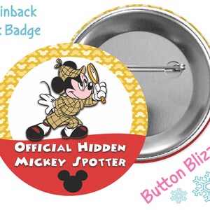 May include: A 3-inch pinback park badge featuring Mickey Mouse dressed as a detective with a magnifying glass. The badge has a yellow background with Mickey Mouse heads and red text that says "Official Hidden Mickey Spotter".