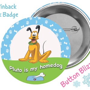 May include: A 3-inch pinback button featuring Pluto, a yellow dog with a red collar, sitting on a green patch of grass. The button has a blue background with white paw prints and bone designs. The text "Pluto is my homedog" is written in white on the button.