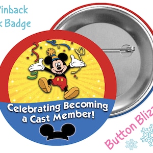 May include: A 3-inch pinback park badge featuring Mickey Mouse celebrating. The badge has a red and blue border with the text "Celebrating Becoming a Cast Member!" and Mickey Mouse ears at the bottom. The background is yellow with starbursts.