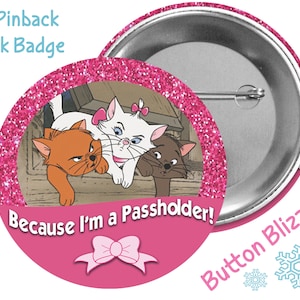 May include: A pink 3-inch pinback park badge with a glitter background. The badge features a cartoon image of three cats from the Disney movie The Aristocats. The text on the badge reads "Because I'm a Passholder!"