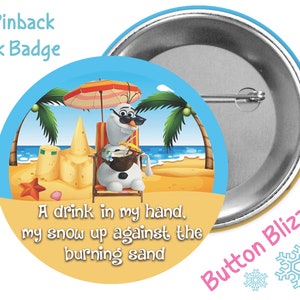 May include: A 3-inch pinback button featuring a cartoon snowman on a beach with a drink in his hand. The text on the button reads "A drink in my hand, my snow up against the burning sand".