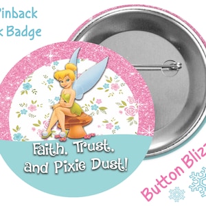 May include: A 3-inch pinback button featuring Tinkerbell sitting on a mushroom. The design includes a pink glitter border, floral accents, and the text "Faith, Trust, and Pixie Dust!" in a light blue section. The words "Button Blizzard" are also present.
