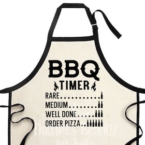 May include: A white cotton apron with black trim and the text "BBQ TIMER" in black. The apron has a list of doneness levels for grilling meat, with the corresponding number of beer bottles next to each level. The list reads: "RARE... MEDIUM... WELL DONE... ORDER PIZZA..."
