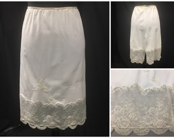 1960s S Beige stretch Nylon knit vintage half slip with 6" double galloon inset lace at hem, lace appliques, 28" waist, 6" back slit