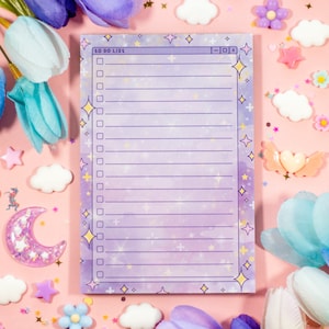 May include: A purple and white to-do list notepad with a glittery background and stars. The notepad has a title bar that says "To Do List" and a check box for each item on the list.