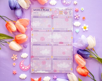 May include: A lavender weekly planner with a grid design, featuring the text "WEEKLY PLAN" and days of the week. The planner has cloud and rose illustrations. Decorative flowers and embellishments surround the planner.