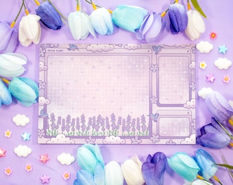 May include: A lavender-colored Brain Dump notepad with a grid pattern, cloud and flower accents, and the text "Brain Dump." The notepad features a lavender field design at the bottom and hummingbird illustrations. Decorative tulips and star-shaped embellishments surround the notepad.