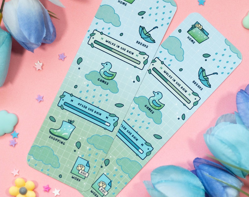 May include: Two blue and green bookmarks with a rain theme. The bookmarks feature a variety of illustrations, including raindrops, clouds, umbrellas, and a duck. The bookmarks also have a slider with the text "Walks in the Rain" and "After the Rain".