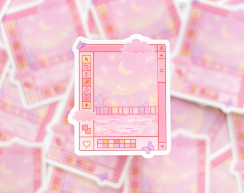 May include: A pink and purple sticker with a cartoon image of a computer screen showing a night sky with a crescent moon, stars, and a cityscape. The screen has a toolbar with icons and a color palette.