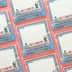 May include: A set of pastel pink and blue desktop sticky notes with a computer screen design. Each note features a white background, a blue computer screen with the word "DESKTOP" at the top, and a small plant icon in the bottom right corner. The notes are decorated with small stars, hearts, and clouds.