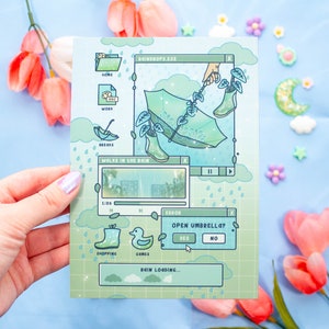 May include: A green and blue illustrated digital art print depicting a computer screen with a rain-themed desktop. The screen shows a video titled "Walks in the Rain" with a green umbrella and rain boots. The screen also has a pop-up window asking "Open Umbrella?" with buttons for "Yes" and "No".