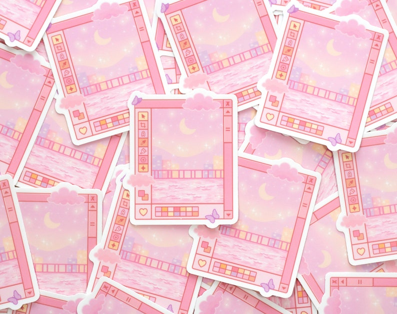 May include: A stack of pink and white stickers with a pixelated city skyline and a crescent moon. The stickers have a computer window design with a toolbar and a color palette.