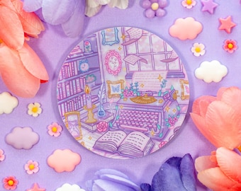 May include: A purple and white ceramic plate with a vintage typewriter, books, and flowers. The plate has a whimsical design with a light purple background and white accents.