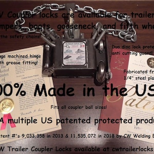 May include: A metal trailer coupler lock with a chain, designed to secure trailers, campers, and boats. The lock is made in the USA and features a machined hinge and anti-cutting guard. The image includes text that says "100% Made in the USA!"