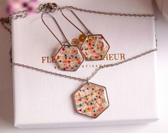 Necklace and dangling earrings with multicolored dried resin flowers. Hexagon shaped jewelry set.