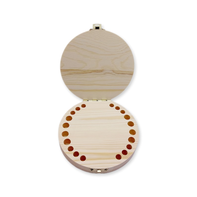 May include: A round wooden box with a hinged lid. The box has a series of small holes around the edge of the bottom.