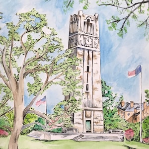 May include: Watercolor painting of a tall stone bell tower with a clock face, surrounded by trees and greenery. Two American flags are visible. The sky is blue with some clouds. The artwork is signed in the bottom right corner.