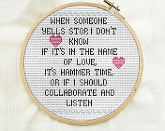 May include: White embroidery hoop with a cross-stitch design that reads "When someone yells stop, I don't know if it's in the name of love, it's hammer time, or if I should collaborate and listen". Two pink hearts are included in the design.