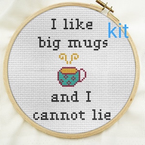 May include: Cross stitch embroidery hoop with the text "I like big mugs and I cannot lie" and a small illustration of a steaming mug.