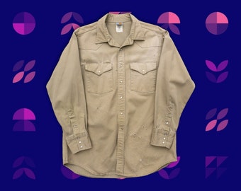 Camisa vintage Carhartt estilo western, tamanho XL – jeans cáqui com botões de pressão perolados, acabamento desgastado.