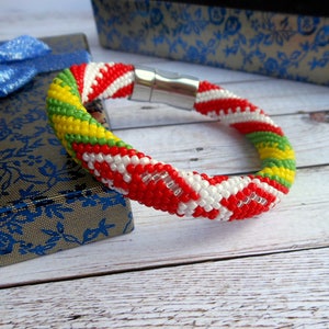 Idde de Orula con detalles de Shango