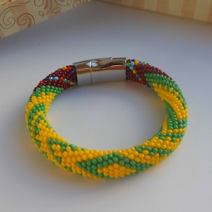 Idde de Orula con detalles de Oya