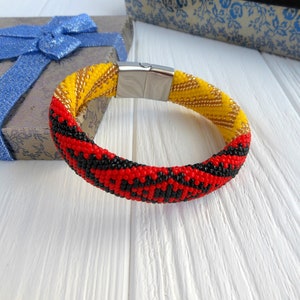 Idde de Elegua con detalles de Oshun Santeria beads Yoruba religion bracelet Santeria gift for brother