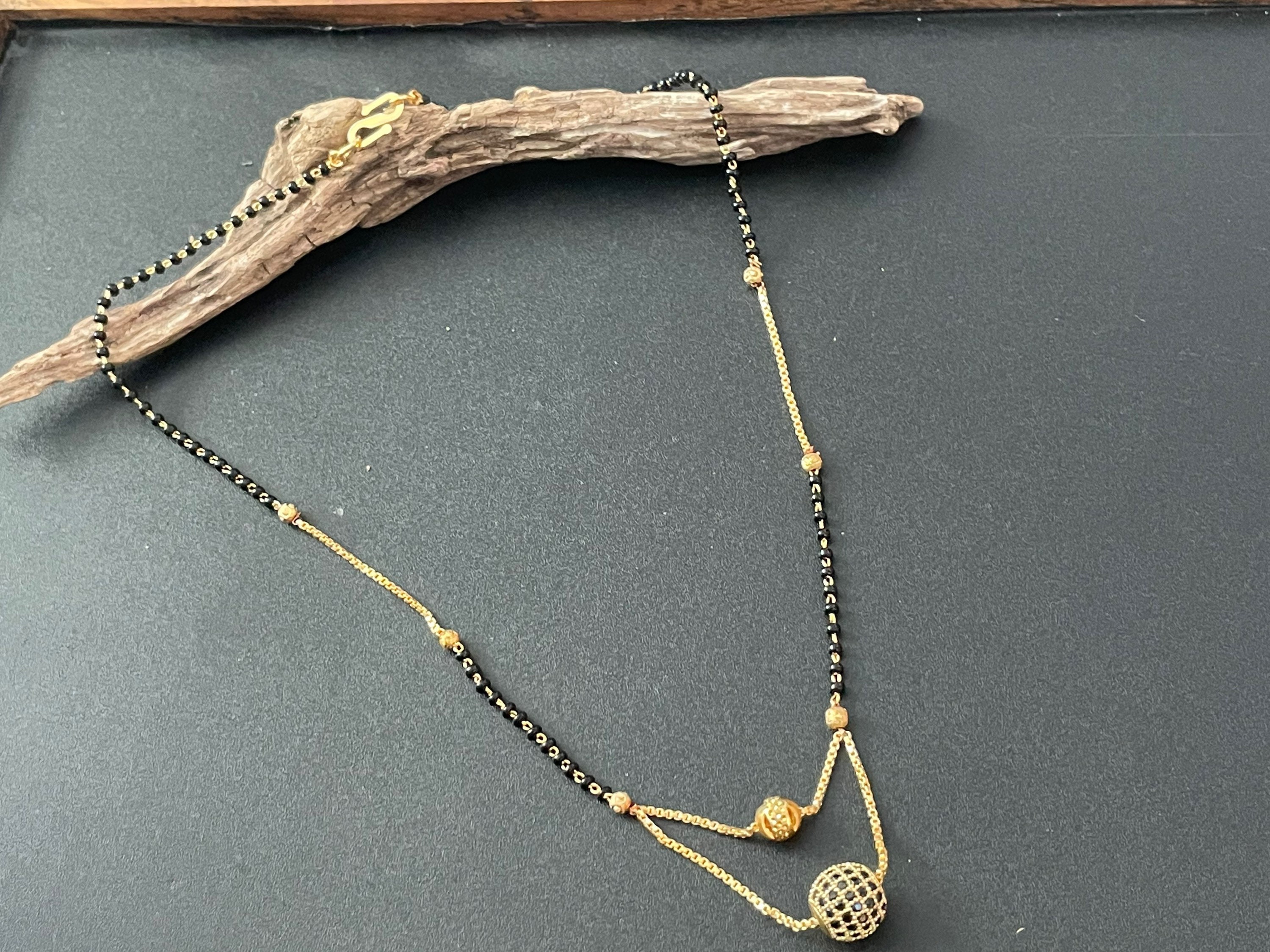 Short black beads gold chain shop