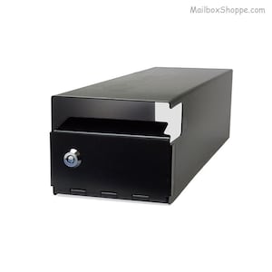 May include: Black metal mailbox with a lock and a slot for mail. The mailbox is designed to be mounted on a wall.