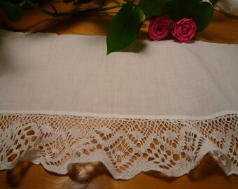 White lace on white cotton fabric