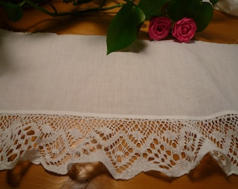 White lace on white cotton fabric