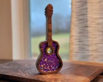 Acoustic guitar art, sun catcher, purple in color.