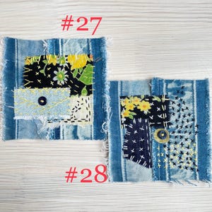 Collection of handmade boro sashiko denim patches created from recycled jeans and fabric scraps with decorative hand stitching.