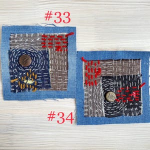 Collection of handmade boro sashiko denim patches created from recycled jeans and fabric scraps with decorative hand stitching.