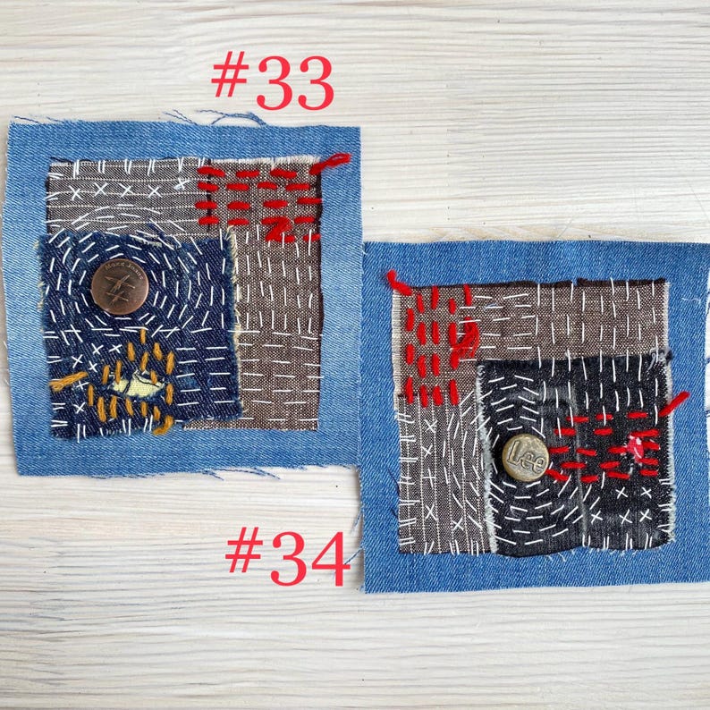 Collection of handmade boro sashiko denim patches created from recycled jeans and fabric scraps with decorative hand stitching.