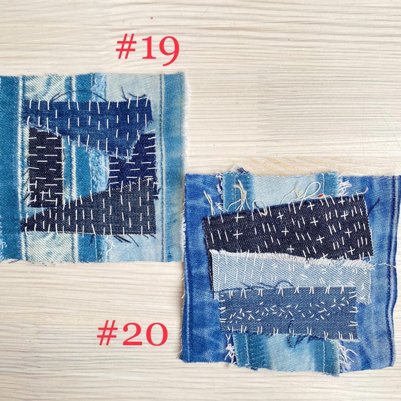 Collection of handmade boro sashiko denim patches created from recycled jeans and fabric scraps with decorative hand stitching.