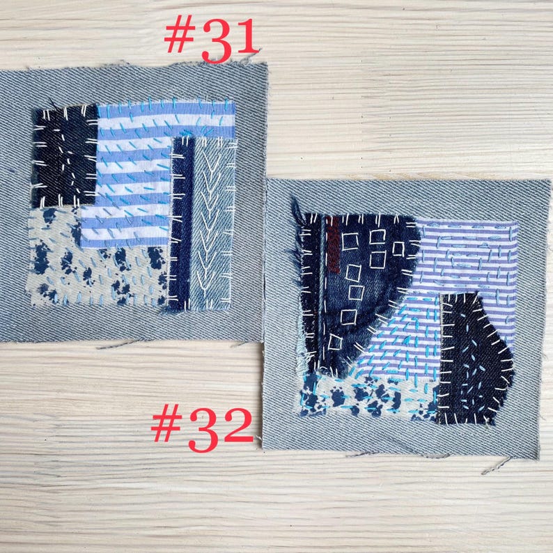 Collection of handmade boro sashiko denim patches created from recycled jeans and fabric scraps with decorative hand stitching.