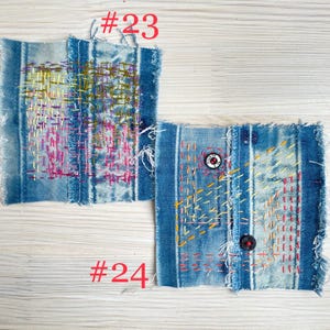 Collection of handmade boro sashiko denim patches created from recycled jeans and fabric scraps with decorative hand stitching.