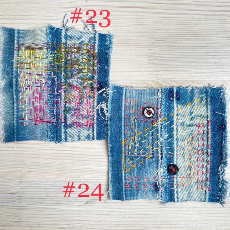Collection of handmade boro sashiko denim patches created from recycled jeans and fabric scraps with decorative hand stitching.