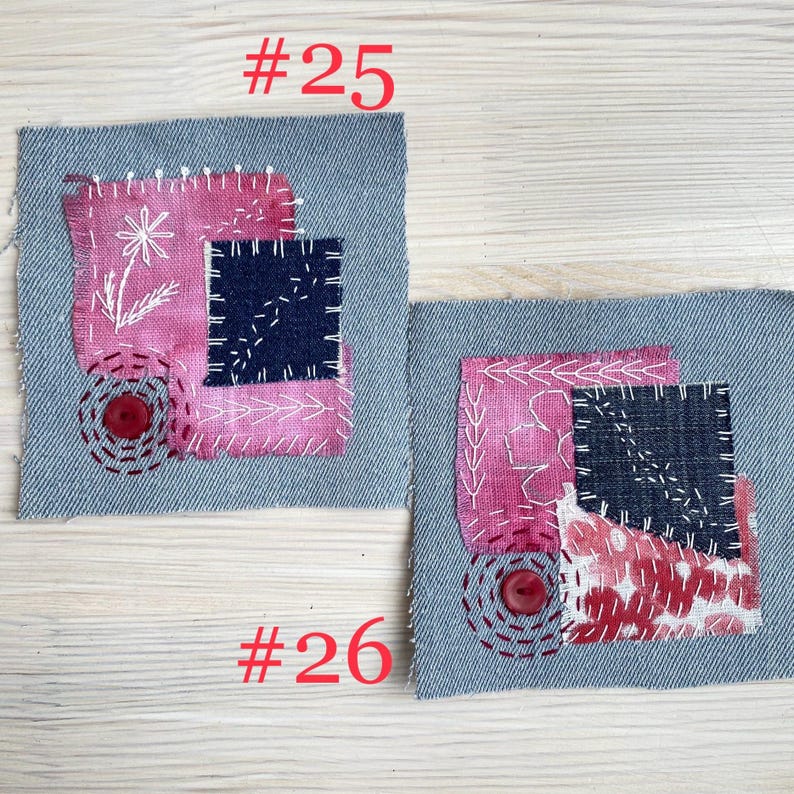 Collection of handmade boro sashiko denim patches created from recycled jeans and fabric scraps with decorative hand stitching.